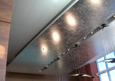 Composition aluminum leaf applied to ceiling panels for the Ross School of Business, Ann Arbor, MI