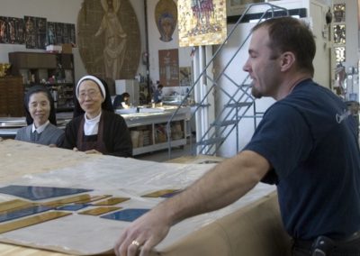 The Sisters work alongside CSS artisans in the creation of their stained glass