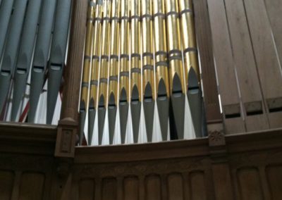 The finished organ pipes are set in place next to the unfinished ones